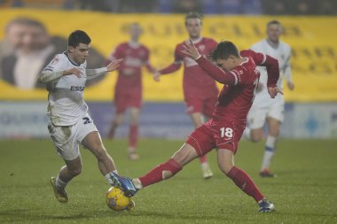 Morecambe 'den Jake Taylor, 13 Şubat 202' de Birkenhead, İngiltere 'deki Prenton Park' ta oynanan Sky Bet League 2 karşılaşmasında Tranmere Rovers - Morecambe maçında Tranmere Rovers 'a karşı Tranmere Rovers maçında Tranmere Rovers' la mücadele etmeye çalıştı.