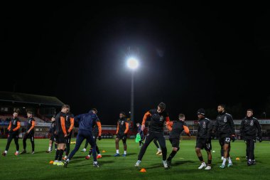 Blackpool oyuncuları, 13 Şubat 202 'de Cheltenham Town' a karşı Blackpool maçı öncesinde oynanan maç öncesi ısınma maçında Cheltenham Stadyumu, Cheltenham 'da oynanacak.