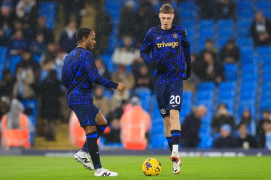 Cole Palmer and Raheem Sterling of Chelsea during the warm up for the Premier League match Manchester City vs Chelsea at Etihad Stadium, Manchester, United Kingdom, 17th February 202 clipart