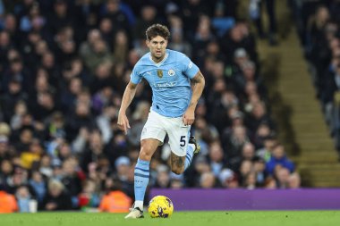 Manchester City 'den John Stones 20 Şubat 202' de Etihad Stadyumu 'nda Manchester City' nin Brentford 'a karşı oynadığı Premier Lig maçında topu aldı.