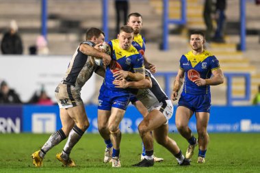 Warrington Wolves takımından Matt Dufty, 23 Şubat 202 'de İngiltere' nin Warrington Stadyumu 'nda oynanan Betfred Süper Lig karşılaşmasında Denive Balmforth Hull FC ve Jordan Lane Hull FC tarafından yenildi.