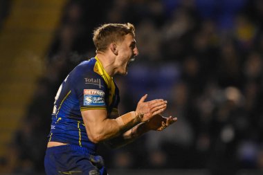 Warrington Wolves 'tan Sam Powell, 23 Şubat 202' de İngiltere 'nin Warrington kentinde oynanan Betfred Süper Lig karşılaşmasında Warrington Wolves' a karşı Hull FC karşılaşmasını kutluyor.