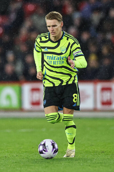 Martin Odegaard of Arsenal makes a break with the ball during the Premier League match Sheffield United vs Arsenal at Bramall Lane, Sheffield, United Kingdom, 4th March 2024