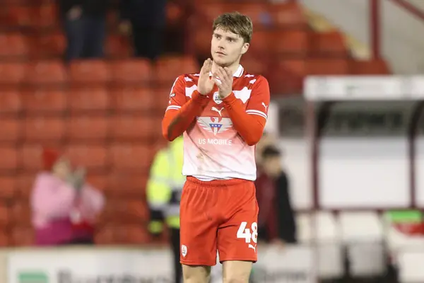 stock image Luca Connell of Barnsley applauds the home fans after the game ends 2-2 during the Sky Bet League 1 match Barnsley vs Bolton Wanderers at Oakwell, Barnsley, United Kingdom, 5th March 202