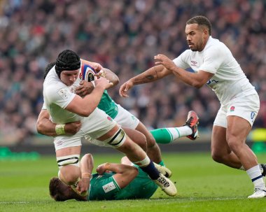Ben Earl of England is tackled by Bundee Aki of Ireland during the 2024 Guinness 6 Nations match England vs Ireland at Twickenham Stadium, Twickenham, United Kingdom, 9th March 202 clipart