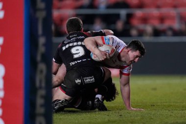 Matt Whitley of St. Helens is held up short of the try line during the Betfred Super League Round 4 match St Helens vs Salford Red Devils at Totally Wicked Stadium, St Helens, United Kingdom, 8th March 202 clipart