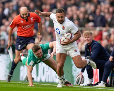 Ollie Lawrence of England breaks past Jack Crowley of Ireland during the 2024 Guinness 6 Nations match England vs Ireland at Twickenham Stadium, Twickenham, United Kingdom, 9th March 202 clipart