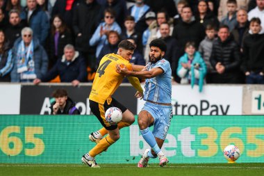Wolverhampton Wanderers 'dan Santiago Bueno ve Coventry City' den Ellis Simms, 16 Mart 202 'de Molineux, Wolverhampton, Wolverhampton, Birleşik Krallık' ta oynanan son karşılaşma olan FA Cup Quarter-