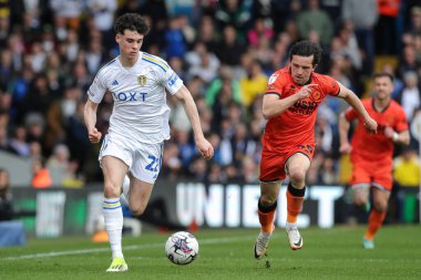 Archie Gray of Leeds United and George Honeyman of Millwall battle for the ball during the Sky Bet Championship match Leeds United vs Millwall at Elland Road, Leeds, United Kingdom, 17th March 202 clipart