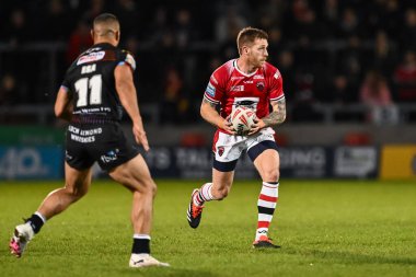 Salford Red Devils takımından Marc Sneyd, Salford Community Stadyumu 'nda oynanan Salford Red Devils vs Wigan Warriors maçında 14 Mart 202' de ilk raundu kazandı.