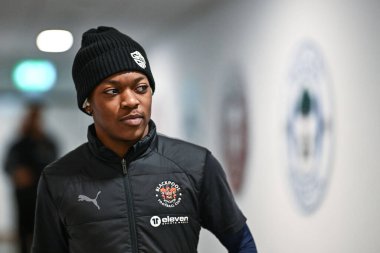 Karamoko Dembele of Blackpool arrives ahead of the Sky Bet League 1 match Wigan Athletic vs Blackpool at DW Stadium, Wigan, United Kingdom, 16th March 202 clipart