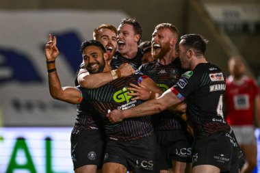 Wigan Warriors 'dan Bevan French, Salford Community Stadyumu, Eccles, Birleşik Krallık' ta oynanan 5. Salford Red Devils vs Wigan Warriors maçındaki maçını kutluyor.