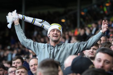 Leeds United supporters cheer on their team during the Sky Bet Championship match Leeds United vs Millwall at Elland Road, Leeds, United Kingdom, 17th March 202 clipart