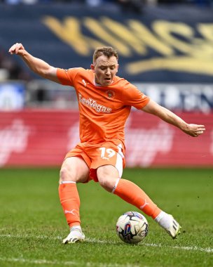 Shayne Lavery of Blackpool shoots on goal during the Sky Bet League 1 match Wigan Athletic vs Blackpool at DW Stadium, Wigan, United Kingdom, 16th March 202 clipart