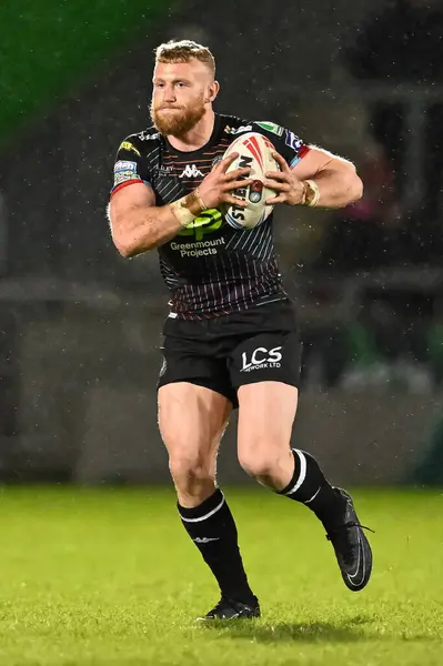 stock image Luke Thompson of Wigan Warriors makes a break during the Betfred Super League Round 5 match Salford Red Devils vs Wigan Warriors at Salford Community Stadium, Eccles, United Kingdom, 14th March 202