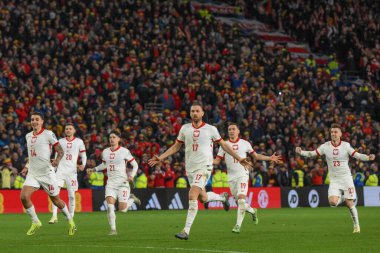 Polonya, 26 Mart 202 'de Cardiff City Stadyumu' nda Galler 'e karşı Galler Avrupa Kalifiye Grubu A karşılaşmasında Galler' e karşı kazandığı penaltı zaferini kutladı.