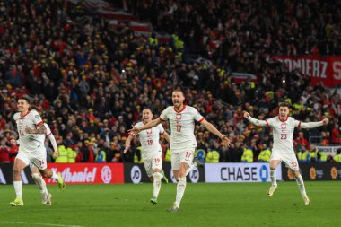 Polonya, 26 Mart 202 'de Cardiff City Stadyumu' nda Galler 'e karşı Galler Avrupa Kalifiye Grubu A karşılaşmasında Galler' e karşı kazandığı penaltı zaferini kutladı.