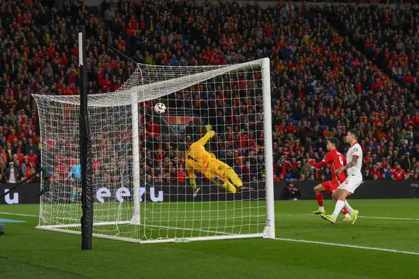 stock image Wojciech Szczsny of Poland makes a save from Kieffer Moore of Wales during the UEFA Euro Qualifiers Eliminator Group A match Wales vs Poland at Cardiff City Stadium, Cardiff, United Kingdom, 26th March 2024