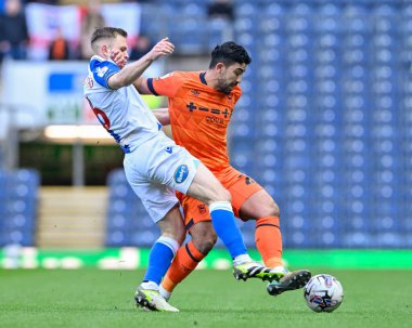 Massimo Luongo  of Ipswich Town and Scott Wharton of Blackburn Rovers battle for the ball, during the Sky Bet Championship match Blackburn Rovers vs Ipswich Town at Ewood Park, Blackburn, United Kingdom, 29th March 202 clipart
