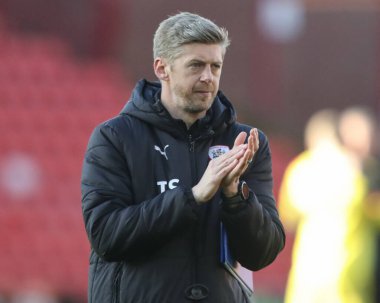 Jon Stead first team coach of Barnsley applauds the home fans after the game during the Sky Bet League 1 match Barnsley vs Cambridge United at Oakwell, Barnsley, United Kingdom, 29th March 202 clipart