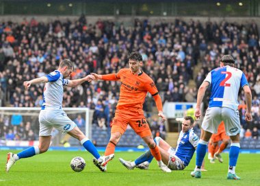Scott Wharton of Blackburn Rovers  and Kieffer Moore of Ipswich Town battle for the ball, during the Sky Bet Championship match Blackburn Rovers vs Ipswich Town at Ewood Park, Blackburn, United Kingdom, 29th March 202 clipart