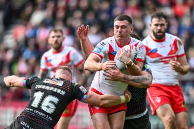Lewis Dodd of St. Helens is tackled by Luke Thompson of Wigan Warriors and Brad ONeill of Wigan Warriors during the Betfred Super League Round 6 match St Helens vs Wigan Warriors at Totally Wicked Stadium, St Helens, United Kingdom, 29th March 2024 clipart