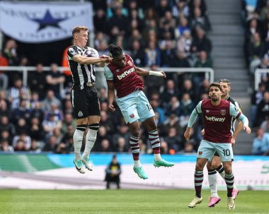 Emil Krafth of Newcastle United  jumps up to win the high ball from Mohammed Kudus of West Ham United during the Premier League match Newcastle United vs West Ham United at St. James's Park, Newcastle, United Kingdom, 30th March 202