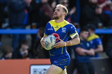 Warrington Wolves takımından Matt Dufty 30 Mart 202 'de Warrington Wolves' a karşı Catalans Dragons 'un oynadığı Betfred Süper Lig karşılaşması öncesinde ısınma turunda