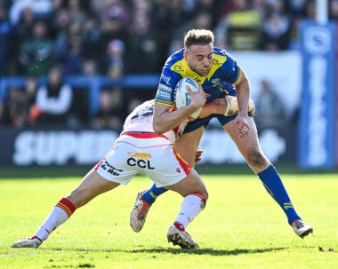 Warrington Wolves 'tan James Harrison, 30 Mart 202' de Halliwell Jones Stadyumu, Warrington 'da oynanan Betfred Süper Ligi karşılaşmasında Katalan Ejderhaları' ndan Ben Garcia tarafından yenildi.