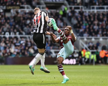 Mohammed Kudus of West Ham United clears the ball from Emil Krafth of Newcastle United during the Premier League match Newcastle United vs West Ham United at St. James's Park, Newcastle, United Kingdom, 30th March 202 clipart