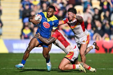 Warrington Wolves takımından Rodrick Tai, 30 Mart 202 'de Warliwell Jones Stadyumu' nda oynanan Betfred Süper Ligi karşılaşmasında Katalan Ejderhaları 'ndan Tariq Sims tarafından yenildi.