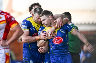 Warrington Wolves 'tan George Williams, 30 Mart 202' de İngiltere 'nin Warrington şehrinde oynanan Betfred Süper Lig karşılaşmasında Warrington Wolves ve Catalans Dragons maçında denemesini kutluyor.