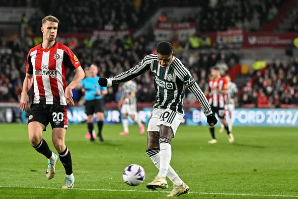 stock image Marcus Rashford of Manchester United crosses the ball during the Premier League match Brentford vs Manchester United at The Gtech Community Stadium, London, United Kingdom, 30th March 202