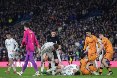 Ethan Ampadu of Leeds United goes down holding his knee during the Sky Bet Championship match Leeds United vs Hull City at Elland Road, Leeds, United Kingdom, 1st April 202 clipart