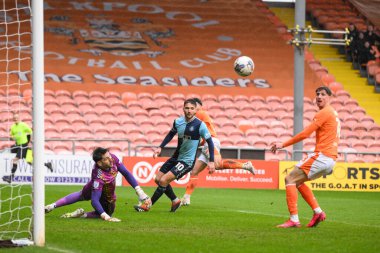 Jordan Lawrence-Gabriel of Blackpool shoots on goal but its saved by Franco Ravizzoli of Wycombe Wanderers during the Sky Bet League 1 match Blackpool vs Wycombe Wanderers at Bloomfield Road, Blackpool, United Kingdom, 1st April 202 clipart