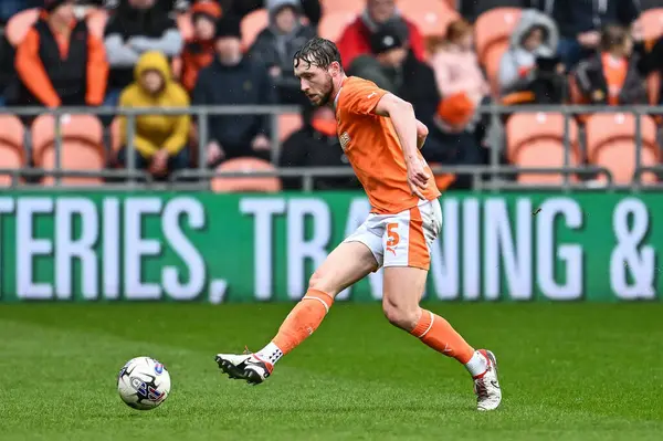 stock image Matthew Pennington of Blackpool passes the ball during the Sky Bet League 1 match Blackpool vs Wycombe Wanderers at Bloomfield Road, Blackpool, United Kingdom, 1st April 202