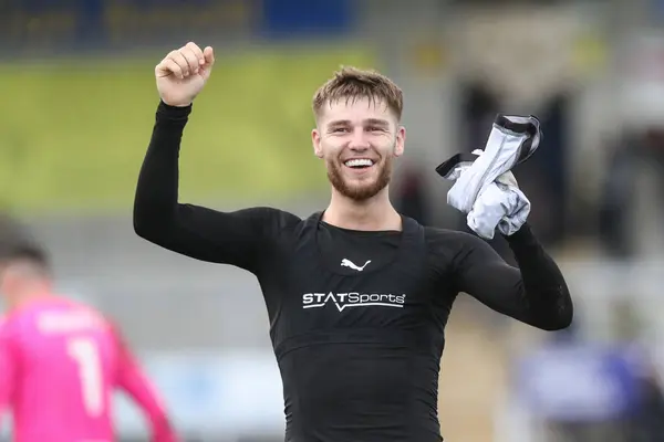 stock image John Mcatee of Barnsley celebrates the win with the fans during the Sky Bet League 1 match Burton Albion vs Barnsley at Pirelli Stadium, Burton upon Trent, United Kingdom, 1st April 202