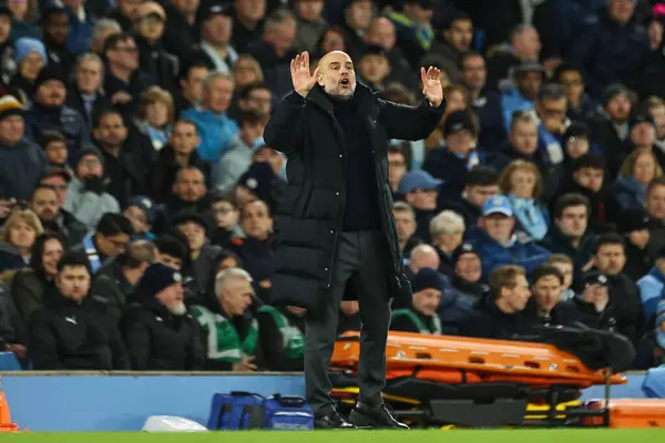 stock image Pep Guardiola manager of Manchester City gives his team instructions during the Premier League match Manchester City vs Aston Villa at Etihad Stadium, Manchester, United Kingdom, 3rd April 202