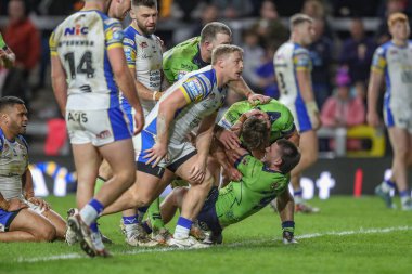 Warrington Wolves takımından Danny Walker, 5 Nisan 202 'de Leeds Gergedan ve Warrington Wolves' a karşı oynanan Betfred Süper Lig karşılaşmasında denemesini kutluyor.