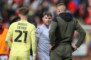 Luca Connell of Barnsley speaks to Harvey Isted of Charlton Athletic after the game during the Sky Bet League 1 match Charlton Athletic vs Barnsley at The Valley, London, United Kingdom, 6th April 202 clipart