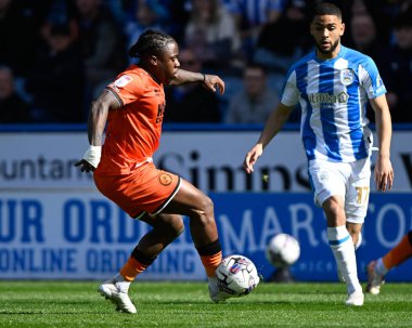 Michael Obafemi of Millwall with the ball during the Sky Bet Championship match Huddersfield Town vs Millwall at John Smith's Stadium, Huddersfield, United Kingdom, 6th April 2024 clipart