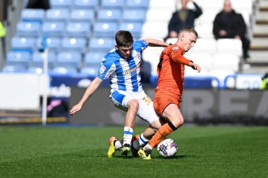 George Saville of Millwall is tackled by Ben Jackson of Huddersfield Townduring the Sky Bet Championship match Huddersfield Town vs Millwall at John Smith's Stadium, Huddersfield, United Kingdom, 6th April 2024 clipart