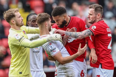 An altercation between John Mcatee of Barnsley and Michael Hector of Charlton Athletic, both receive a yellow card during the Sky Bet League 1 match Charlton Athletic vs Barnsley at The Valley, London, United Kingdom, 6th April 202 clipart