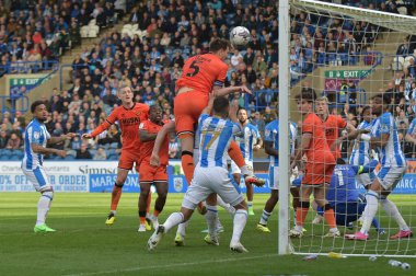 Jake Cooper of Millwall heads the ball over the cross bar during the Sky Bet Championship match Huddersfield Town vs Millwall at John Smith's Stadium, Huddersfield, United Kingdom, 6th April 2024 clipart