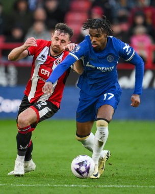 Carney Chukwuemeka of Chelsea and Jack Robinson of Sheffield United battle for the ball during the Premier League match Sheffield United vs Chelsea at Bramall Lane, Sheffield, United Kingdom, 7th April 202 clipart