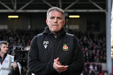 Phil Parkinson manager of Wrexham walks towards the bench ahead of kick off, during the Sky Bet League 2 match Wrexham vs Crawley Town at SToK Cae Ras, Wrexham, United Kingdom, 9th April 202 clipart