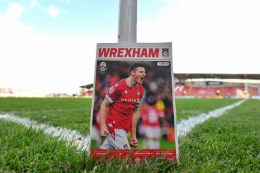 Paul Mullin of Wrexham on the cover of the match day program pitch side of the SToK Cae Ras ahead of the Sky Bet League 2 match Wrexham vs Crawley Town at SToK Cae Ras, Wrexham, United Kingdom, 9th April 202 clipart