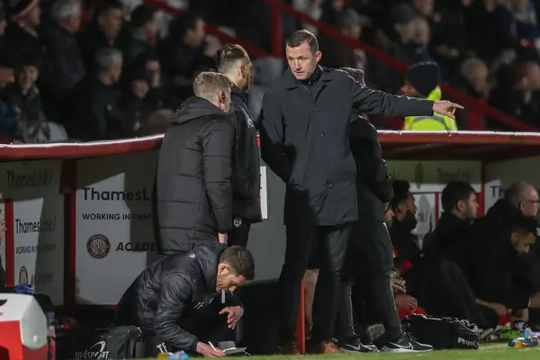 stock image Neill Collins Head coach of Barnsley speaks to Martin Devaney first team coach of Barnsley and Jon Stead first team coach of Barnsley during the Sky Bet League 1 match Stevenage vs Barnsley at Lamex Stadium, Stevenage, United Kingdom, 9th April 202