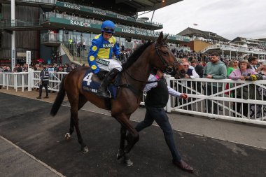 Longer Dan ridden by Harry Skelton make there way to the course for the wins the 3.30pm The William Hill Aintree Hurdle (Class 1) during the Randox Grand National 2024 Opening Day at Aintree Racecourse, Liverpool, United Kingdom, 11th April 202 clipart