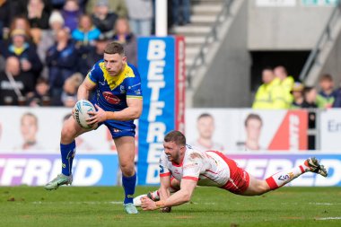 Warrington Wolves takımından George Williams, St. Helens ile Warrington Wolves arasındaki Betfred Challenge Kupası çeyrek final maçında St. Helens, St Helens, St Wicked Stadyumu, İngiltere 'de 14 Nisan 202' de oynanan karşılaşmada St. Helens 'li Joe Batchelor' dan bir hücum hakkı kazandı.